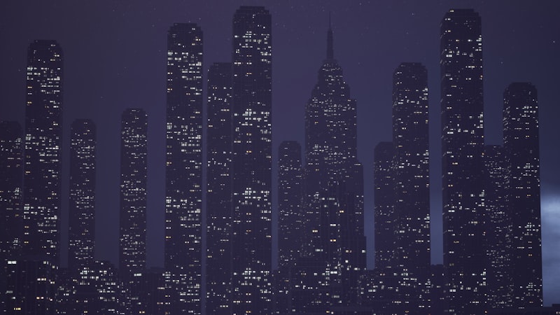 City at night with tall buildings